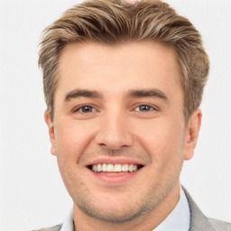 Joyful white young-adult male with short  brown hair and brown eyes