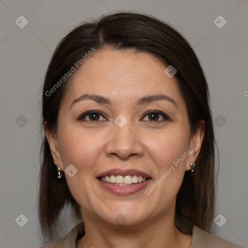 Joyful white adult female with medium  brown hair and brown eyes