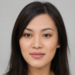 Joyful asian young-adult female with long  brown hair and brown eyes