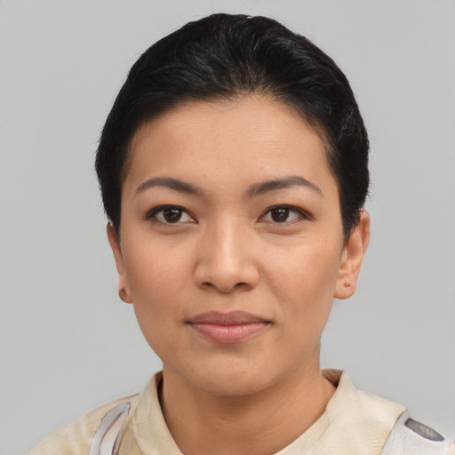 Joyful asian young-adult female with short  black hair and brown eyes