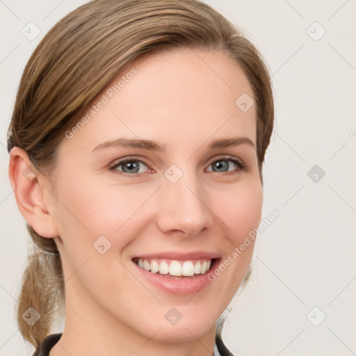 Joyful white young-adult female with medium  brown hair and blue eyes