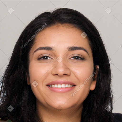 Joyful latino young-adult female with long  black hair and brown eyes