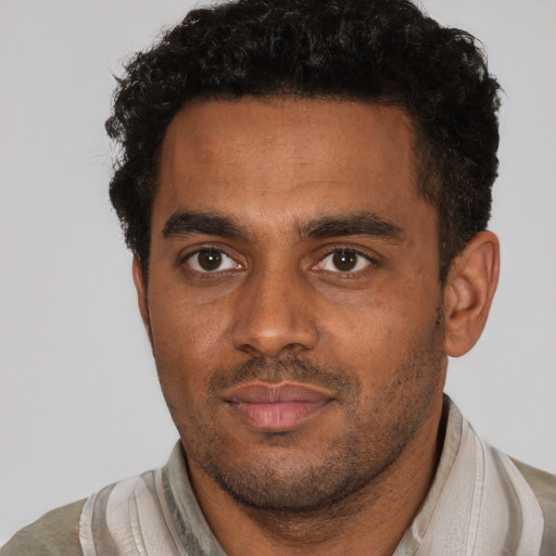 Neutral black young-adult male with short  brown hair and brown eyes