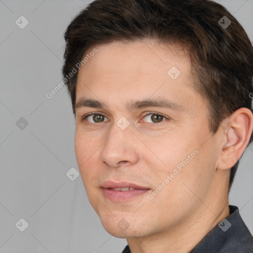 Joyful white adult male with short  brown hair and brown eyes