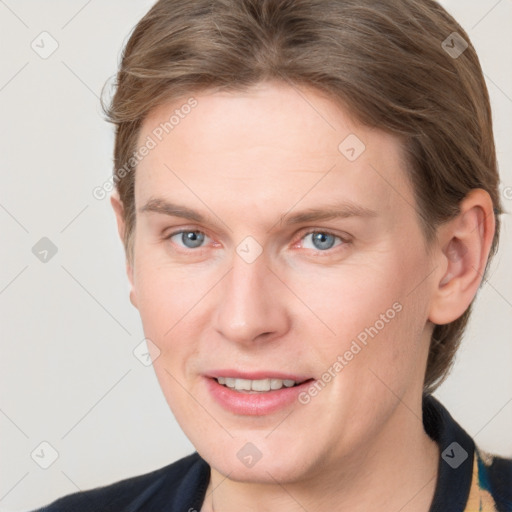 Joyful white adult female with medium  brown hair and grey eyes