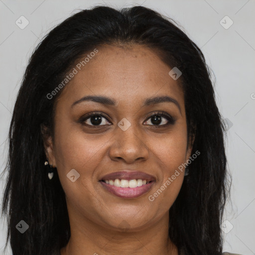 Joyful black young-adult female with long  brown hair and brown eyes