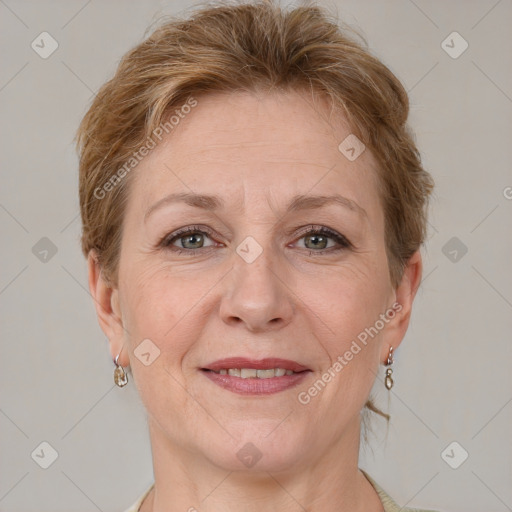 Joyful white adult female with short  brown hair and grey eyes