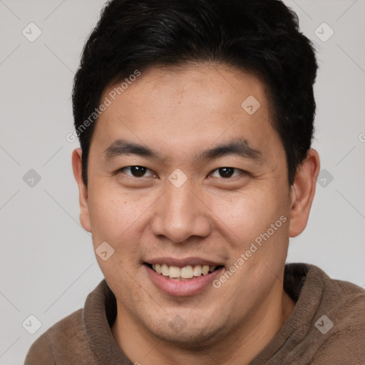 Joyful white young-adult male with short  brown hair and brown eyes