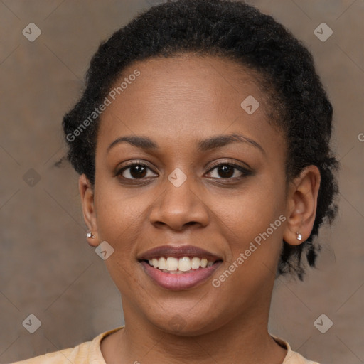 Joyful black young-adult female with short  brown hair and brown eyes