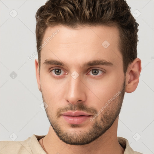 Neutral white young-adult male with short  brown hair and grey eyes