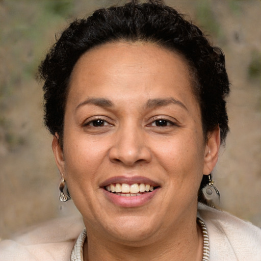 Joyful white adult female with short  brown hair and brown eyes