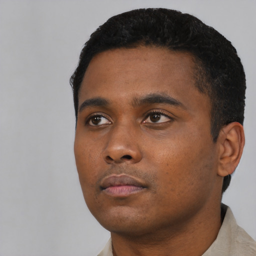 Neutral black young-adult male with short  black hair and brown eyes