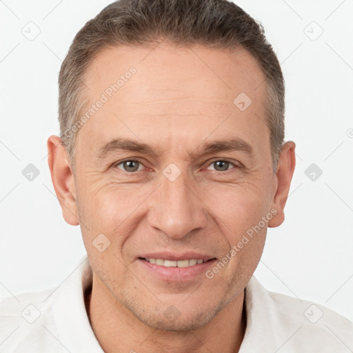 Joyful white adult male with short  brown hair and brown eyes