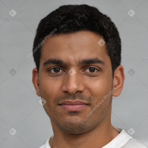 Neutral latino young-adult male with short  black hair and brown eyes