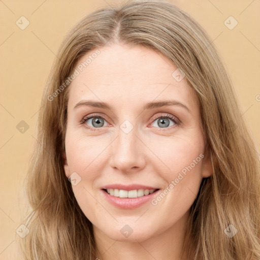 Joyful white young-adult female with long  brown hair and grey eyes