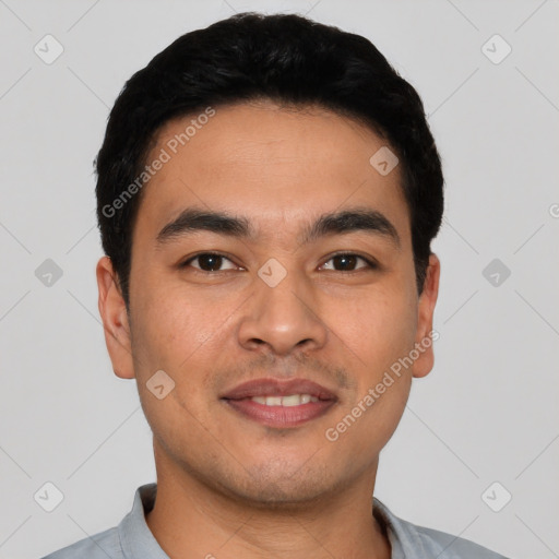 Joyful latino young-adult male with short  black hair and brown eyes