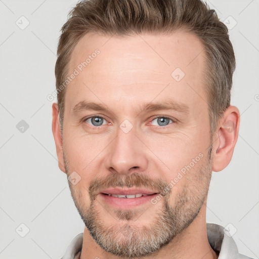 Joyful white adult male with short  brown hair and grey eyes