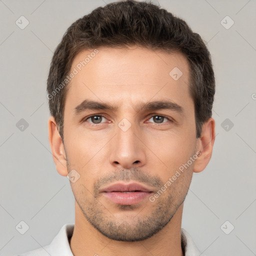 Neutral white young-adult male with short  brown hair and brown eyes