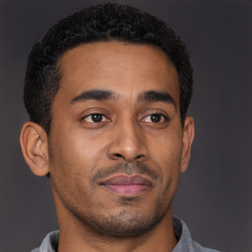 Neutral latino young-adult male with short  brown hair and brown eyes