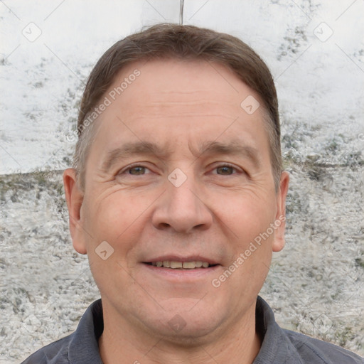 Joyful white adult male with short  brown hair and grey eyes