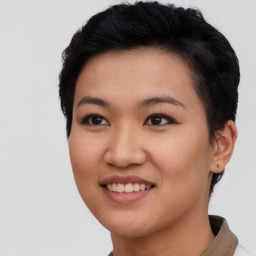 Joyful asian young-adult female with short  black hair and brown eyes