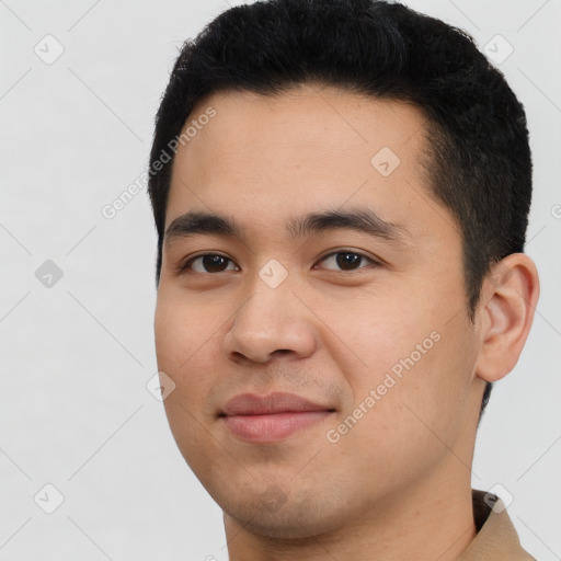 Joyful latino young-adult male with short  black hair and brown eyes