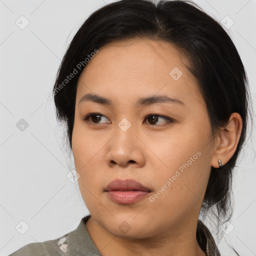 Joyful asian young-adult female with medium  black hair and brown eyes