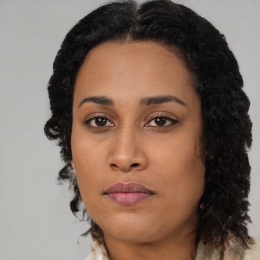Neutral black young-adult female with long  black hair and brown eyes