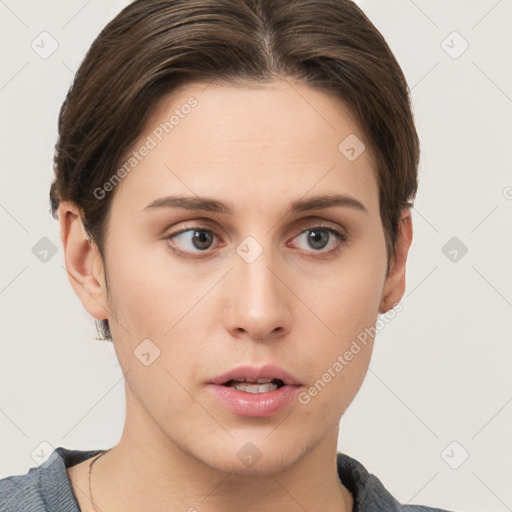 Neutral white young-adult female with short  brown hair and brown eyes