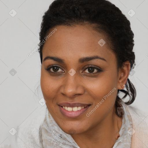 Joyful black young-adult female with medium  brown hair and brown eyes