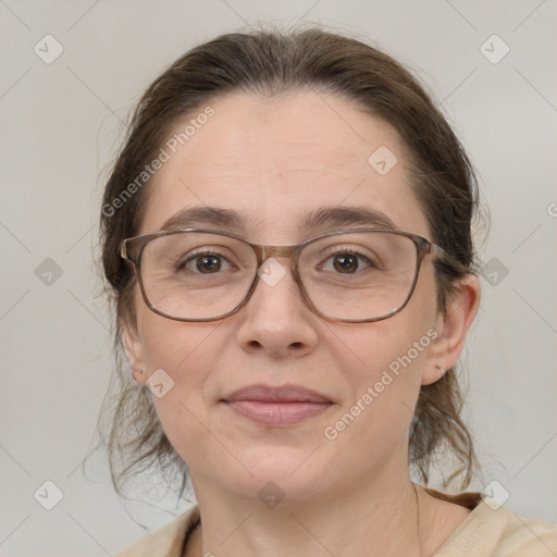 Joyful white adult female with medium  brown hair and brown eyes