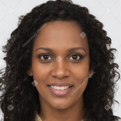 Joyful black young-adult female with long  brown hair and brown eyes