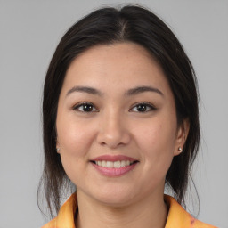 Joyful asian young-adult female with medium  brown hair and brown eyes