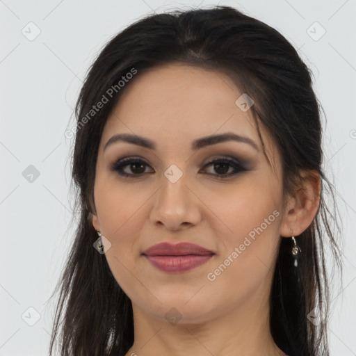 Joyful latino young-adult female with long  brown hair and brown eyes