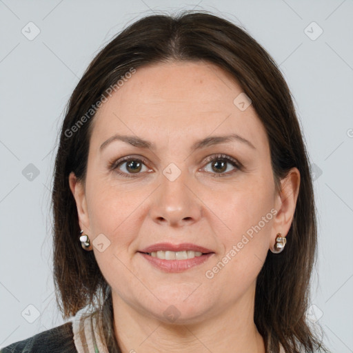 Joyful white adult female with medium  brown hair and brown eyes