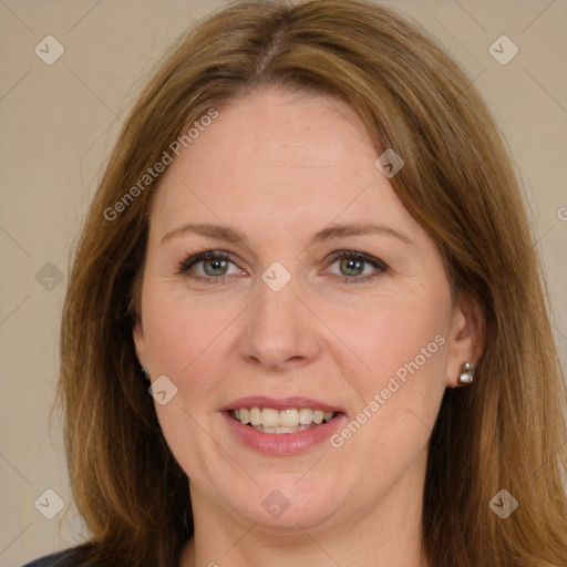 Joyful white adult female with long  brown hair and brown eyes