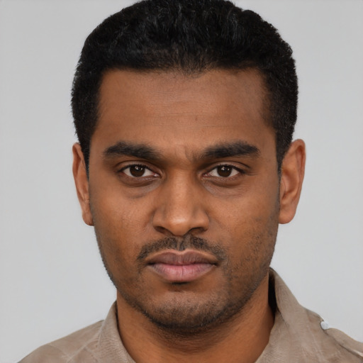 Neutral latino young-adult male with short  black hair and brown eyes