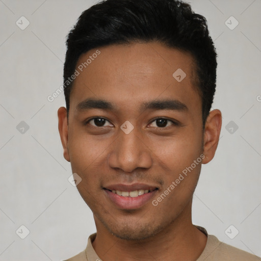 Joyful latino young-adult male with short  brown hair and brown eyes