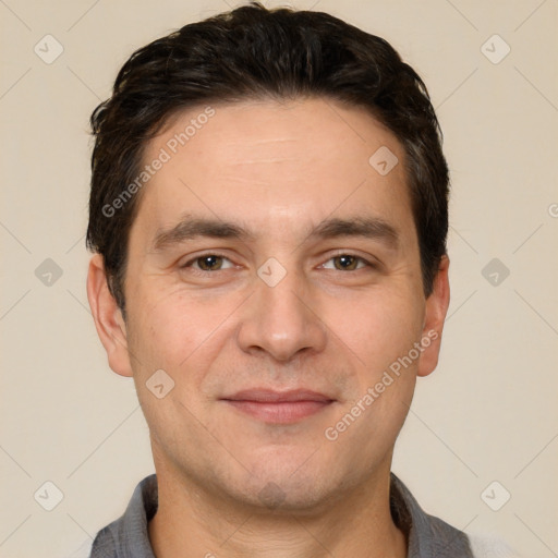 Joyful white young-adult male with short  black hair and brown eyes