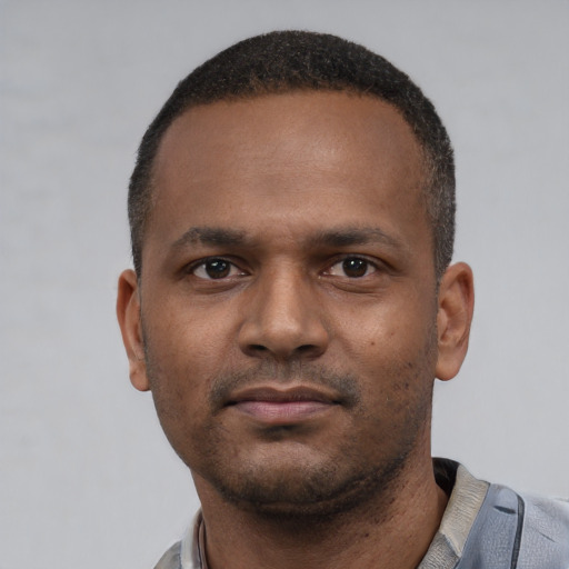 Neutral latino young-adult male with short  brown hair and brown eyes