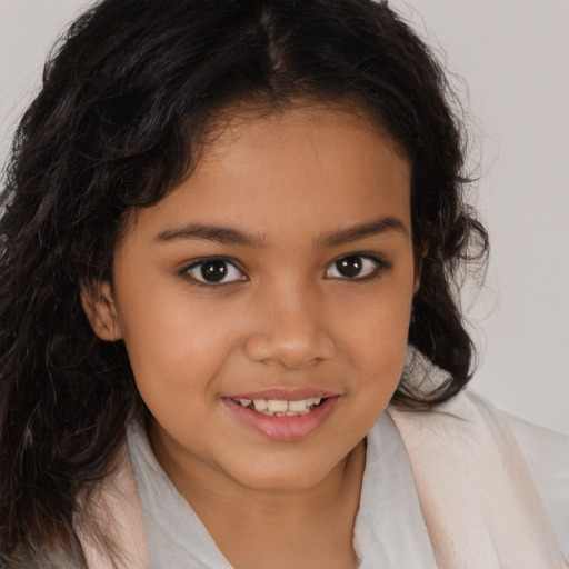 Joyful latino child female with medium  brown hair and brown eyes