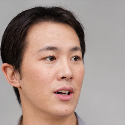 Neutral asian young-adult male with short  brown hair and brown eyes