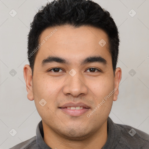 Joyful white young-adult male with short  black hair and brown eyes