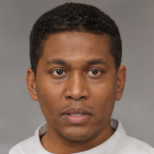 Neutral black young-adult male with short  black hair and brown eyes