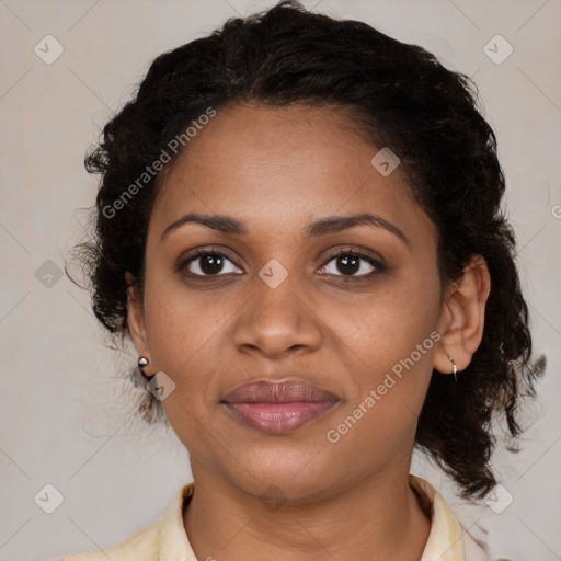 Joyful black young-adult female with medium  brown hair and brown eyes