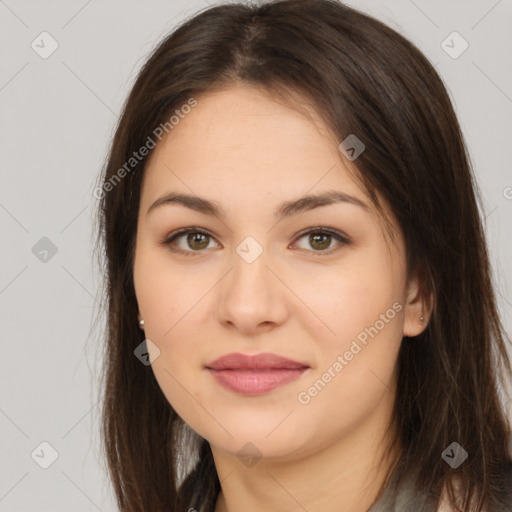 Joyful asian young-adult female with long  brown hair and brown eyes