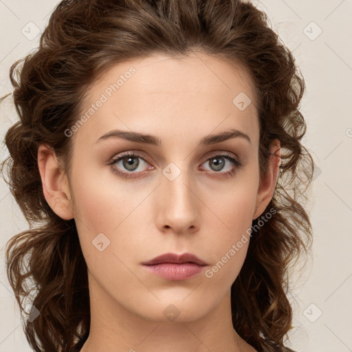 Neutral white young-adult female with long  brown hair and green eyes