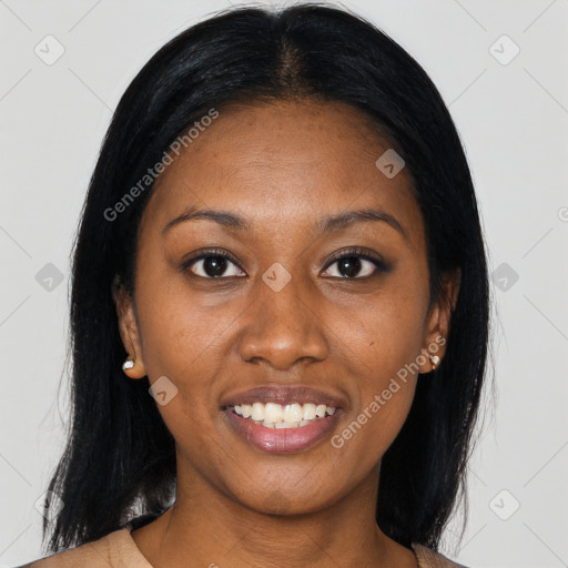 Joyful black young-adult female with long  black hair and brown eyes