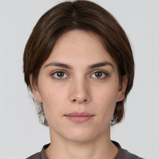 Neutral white young-adult female with medium  brown hair and brown eyes