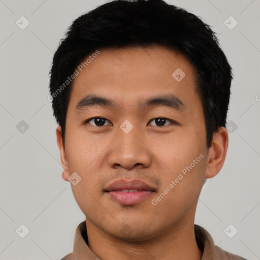 Joyful asian young-adult male with short  black hair and brown eyes